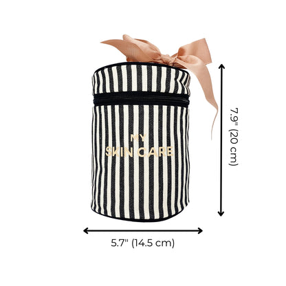 Bag-all Round Skin Care Case with Handle in black and white stripes, gold text, peach bow accent, featuring secure compartments, 5.7" width, 7.9" height, perfect for beauty organization