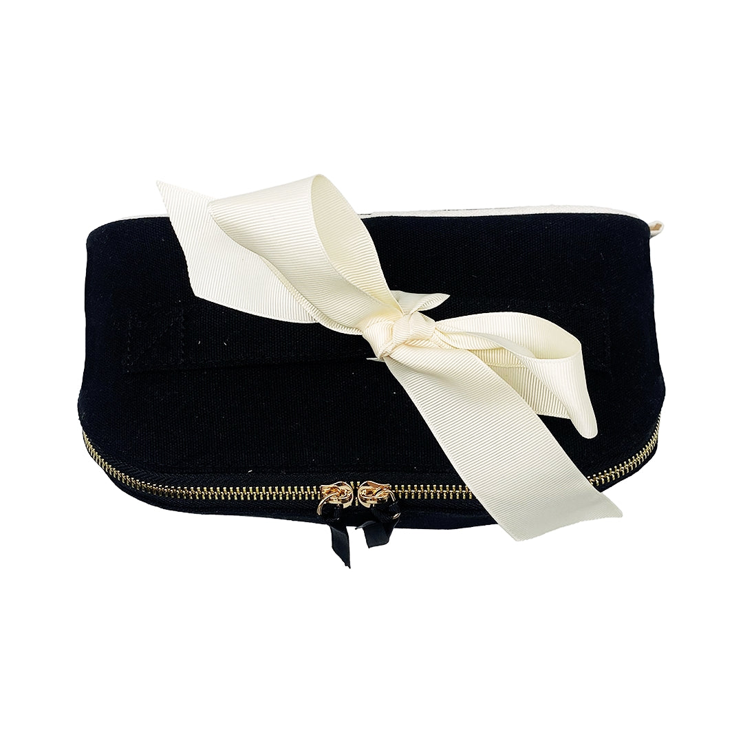 Bag-all Accordion Box Makeup & Toiletry in Black, elegantly folded with a cream ribbon. Compact, stylish, and perfect for travel organization