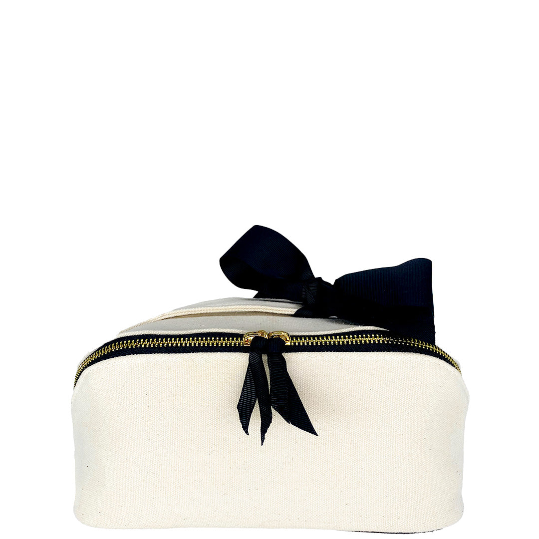 Bag-all Accordion Box Makeup & Toiletry in Cream. Elegant travel organizer with gold zippers and a black ribbon for a chic touch