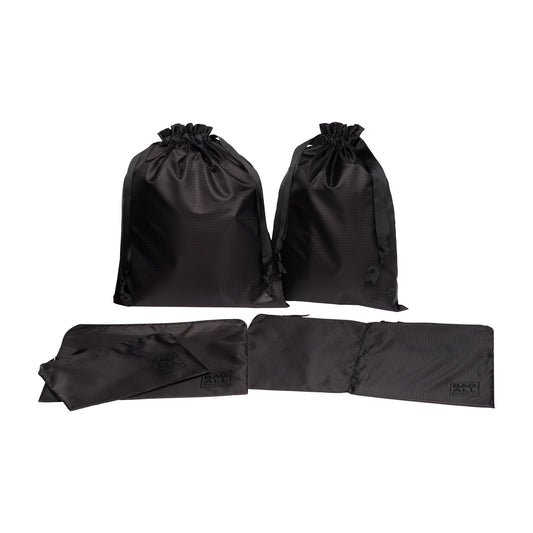 Bag-all Basic Packing Bags Set in recycled nylon, featuring 5 black travel organizers with drawstring closures, perfect for efficient suitcase organization and sustainable travel