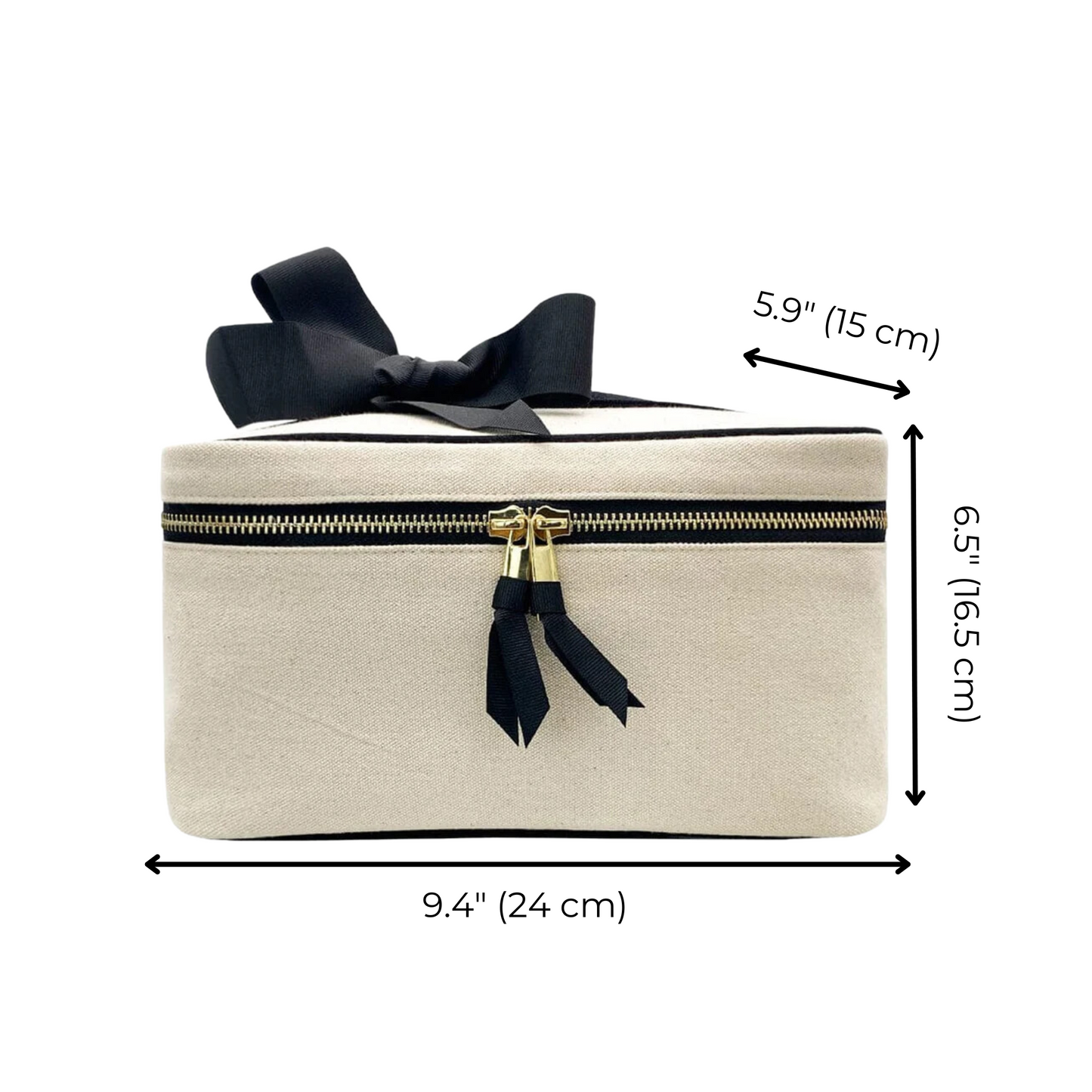 Bag-all Medium Box Makeup & Toiletry case in cream with black bow, gold zipper and striped interior lining. Features measurements 9.4x5.9x6.5 inches.