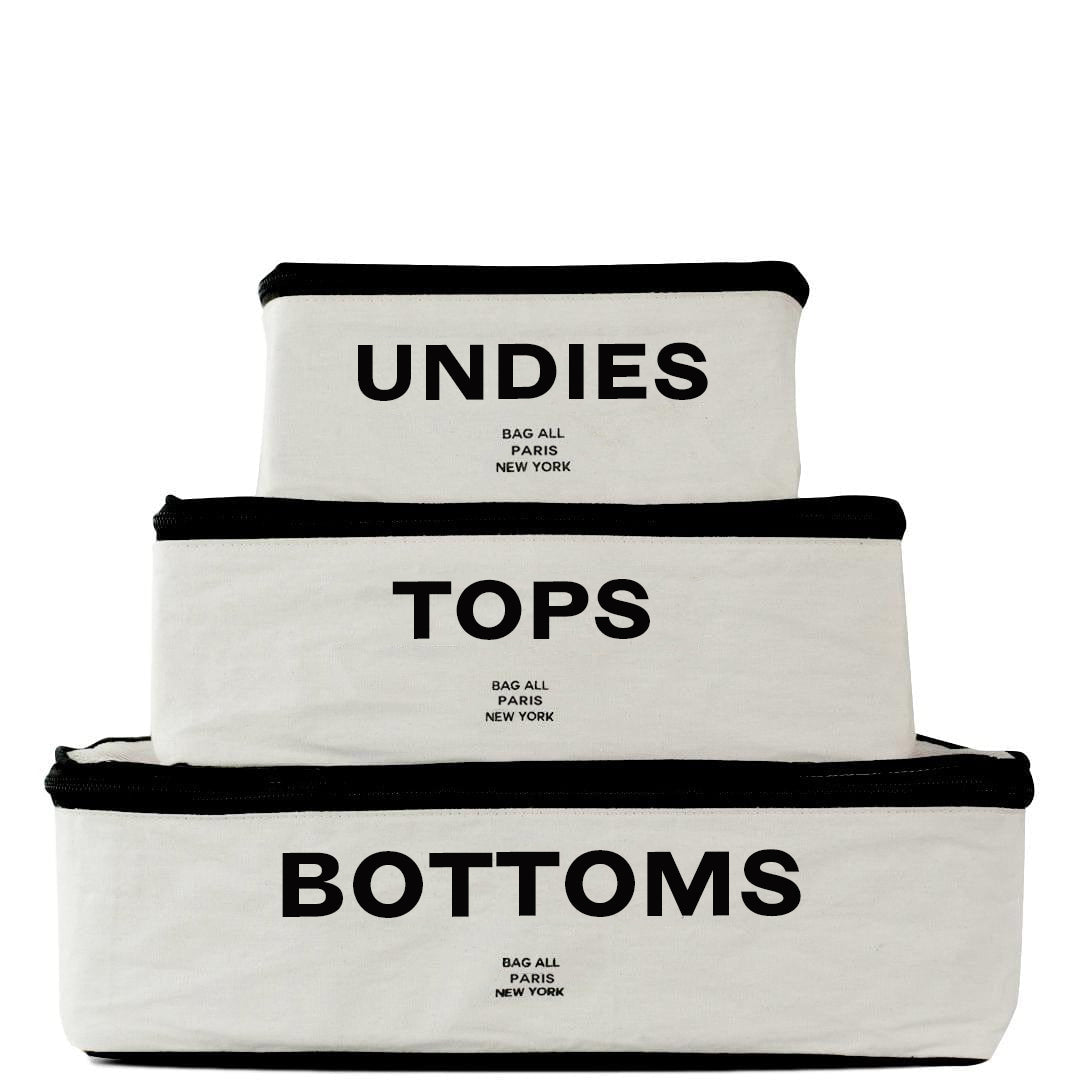 White packing cubes in small medium and large.