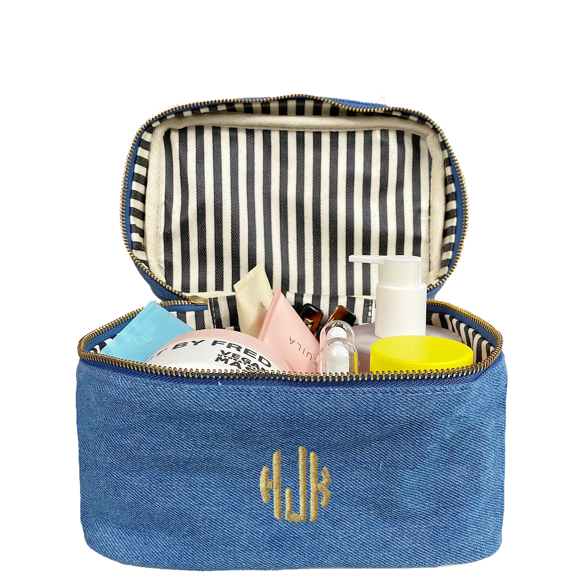 Bag-all My Makeup Cosmetic Box in Denim featuring striped interior lining, waterproof material, and spacious storage compartment with monogram detail. Perfect for organizing beauty essentials and travel.