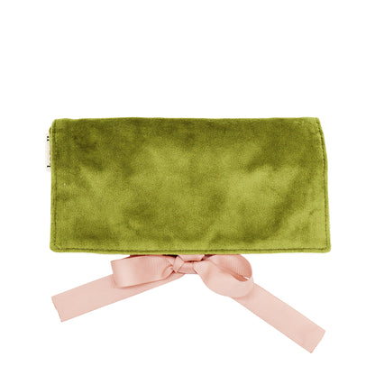 Bag-all Couture Jewelry Roll Medium in luxurious green velvet, featuring three compartments, leather earring holder and ring storage with elegant pink bow closure