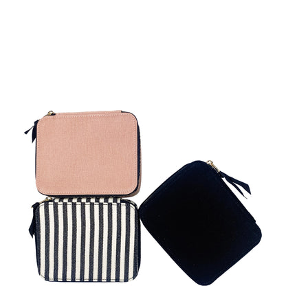 Bag-all Large Pill Travel Case in pink, navy, and striped cotton designs with secure zipper closure and daily organizer compartments. Stylish medication storage solution.