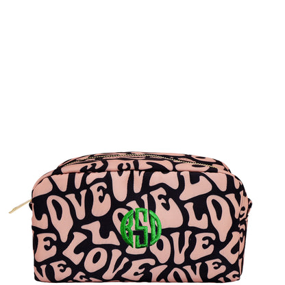 Bag-all Toiletry Pouch featuring pink and black Love pattern with green monogram, eco-friendly recycled PET material, water-resistant interior, compact travel organizer