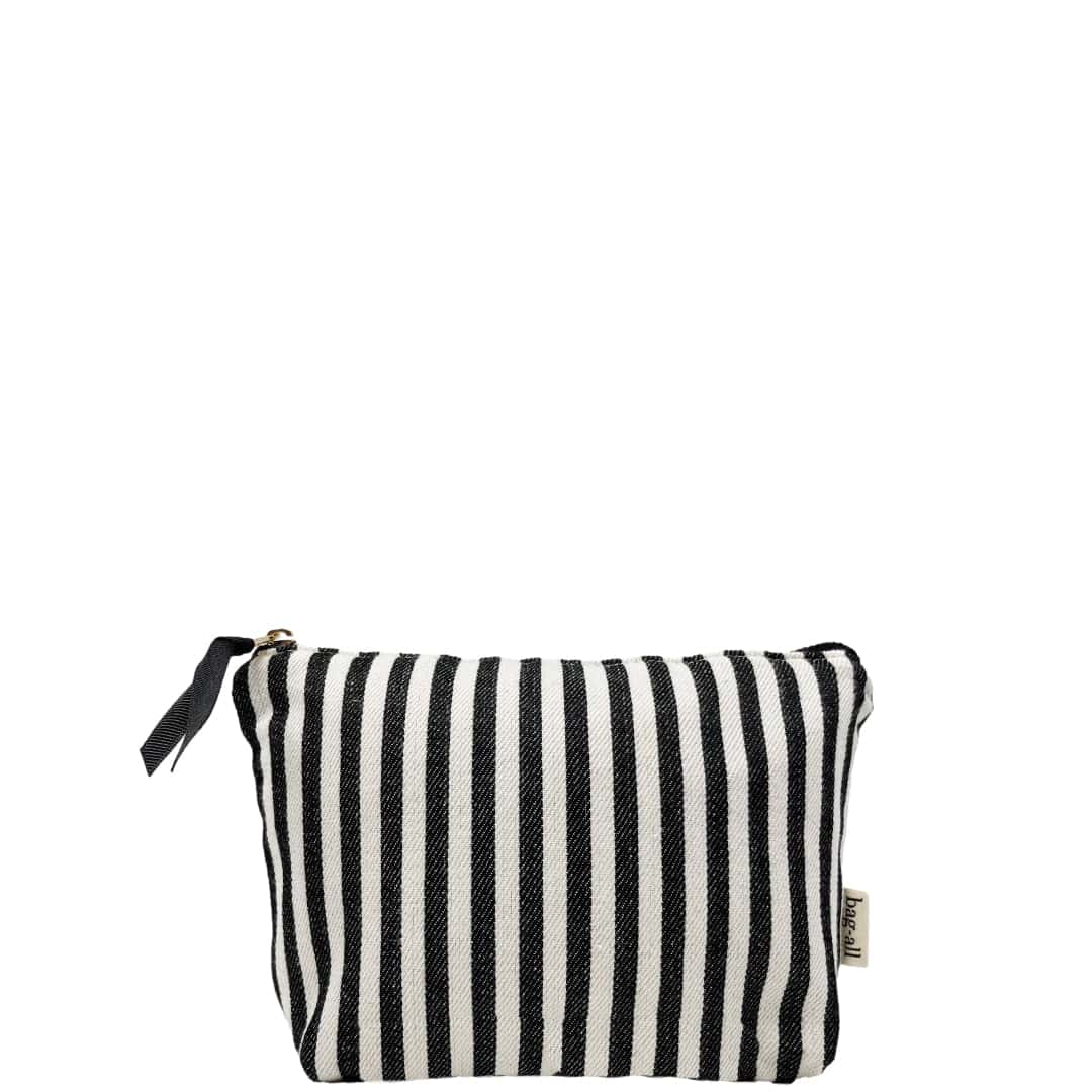 Bag-all Striped Makeup Pouch with pink waterproof lining, black and white vertical stripes, gold zipper closure, compact cotton cosmetic organizer perfect for daily essentials