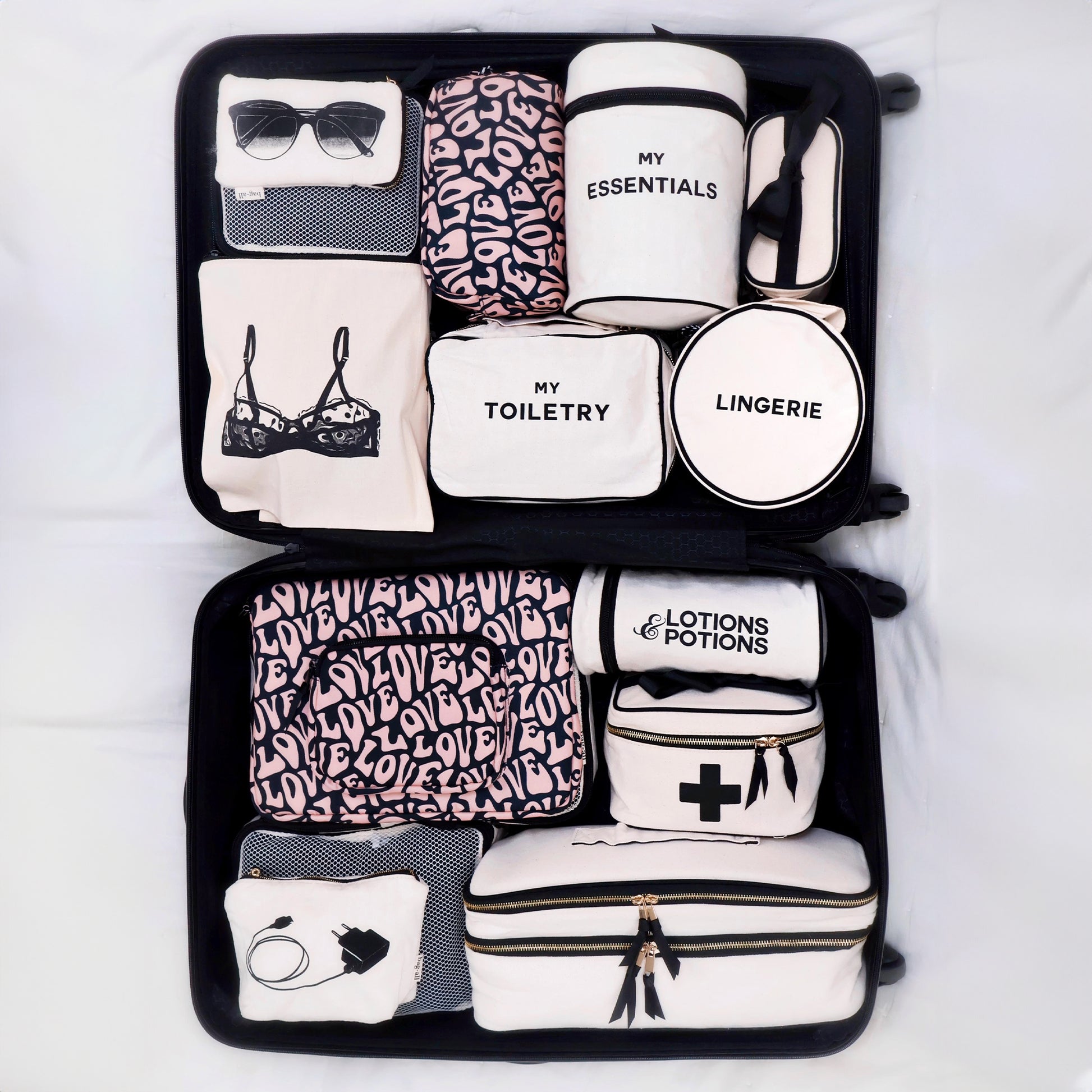 Bag-all Toiletry Pouch Love Pattern featuring organized travel compartments for essentials, lingerie, and toiletries in stylish black and pink design with labeled sections for easy packing