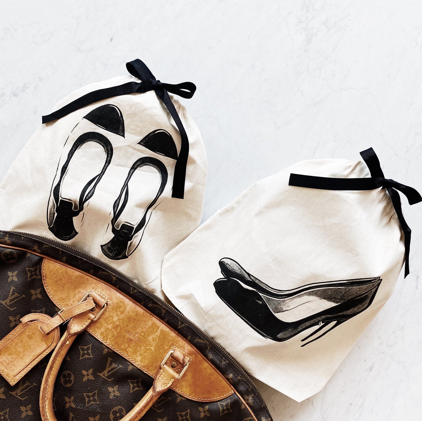 Bag-all Ballet Flat and High Heel Shoe Bags in cream with black bows. Stylish cotton pouches for travel shoe storage