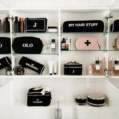 Organized bathroom with black and pink products from bag-all. 