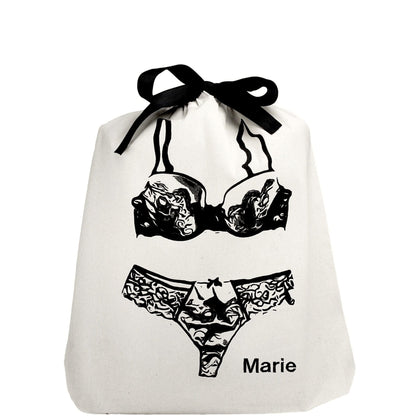 Bag-all Lace Lingerie Travel Bag in cream cotton featuring black lingerie illustration with chic bow closure, perfect for organized travel and storage