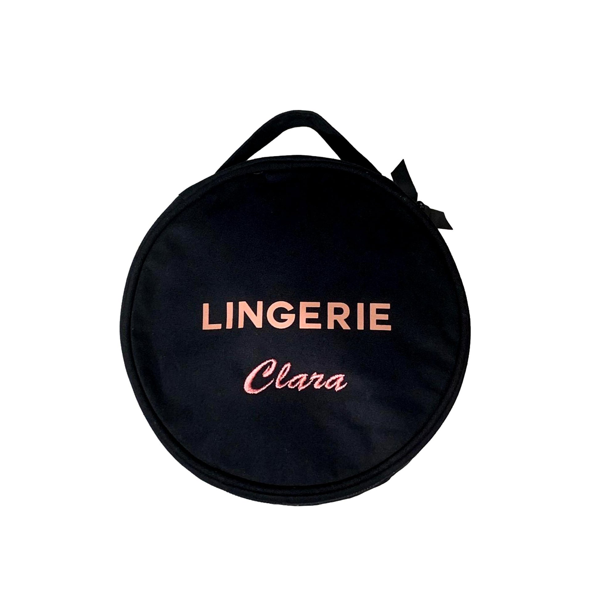 Bag-all Round Lingerie Case in black with pink personalized text, featuring dual zippers, carry handle and recycled ribbon details for elegant travel organization