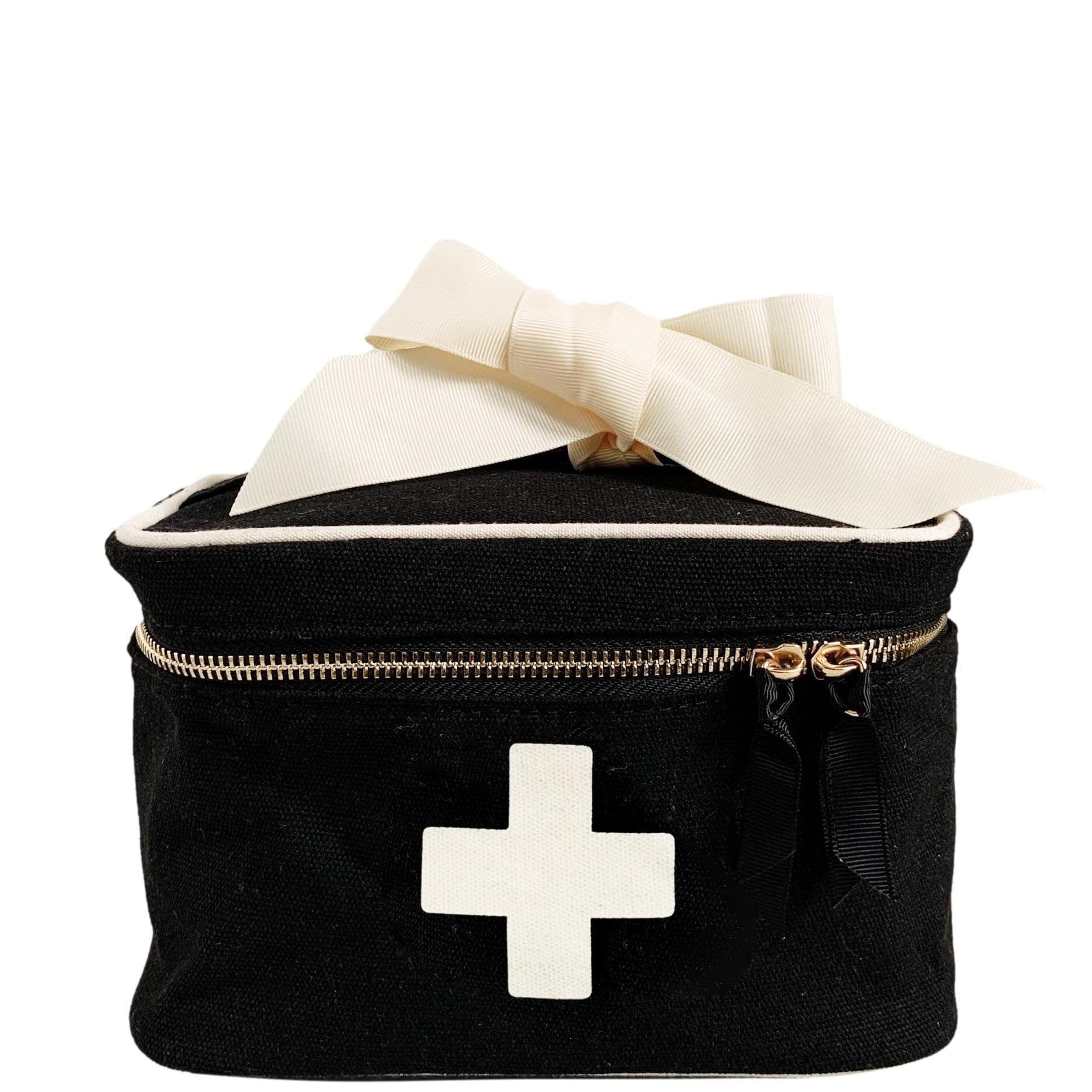 Bag-all First Aid Storage Box in black canvas with white medical cross, cream ribbon, and metal zipper - portable medicine and first aid organizer