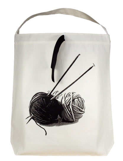 Knitting bag with two yarns on the front. 